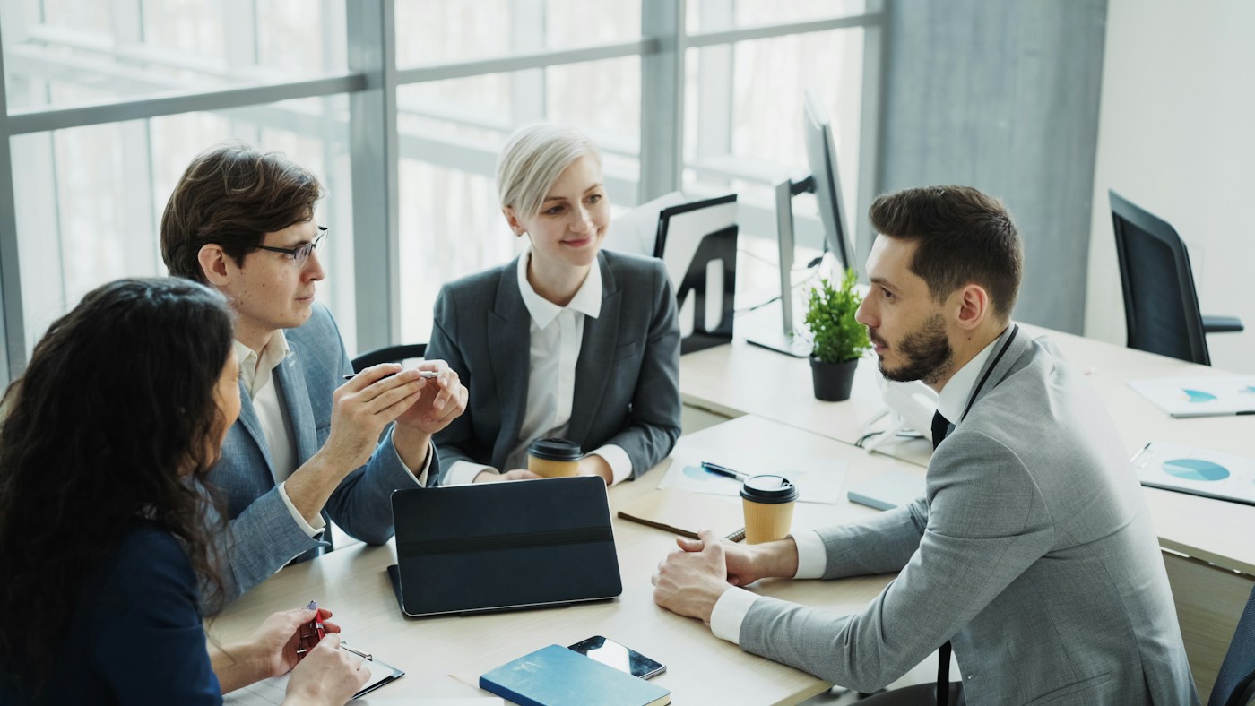 Diverse business team discussing decisions
